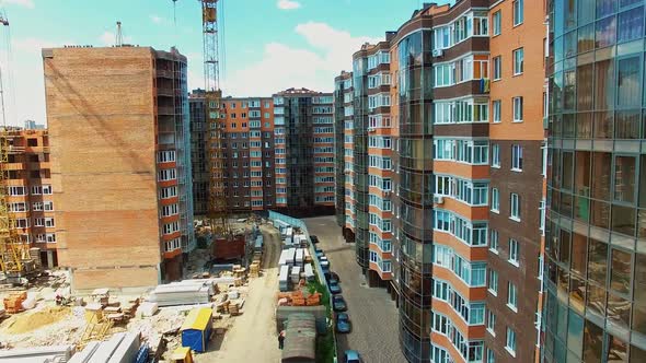 Construction site of a multi-storey building. New architecture builds in the modern residential comp