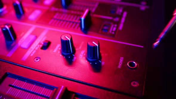Closeup of Headphone Jack on Mixing Console Into Which DJ Sticks Wire