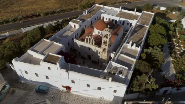 Aerial view of Agios Nikolaos church in Spetses next to a road, Greece.