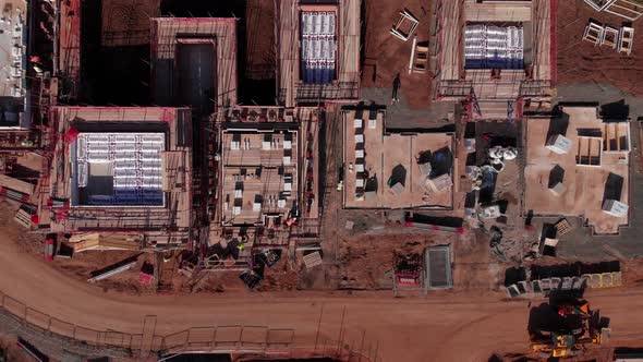 Brick Layers Working Bird's Eye View Construction Site Housing Estate Zooming Out Aerial 4K