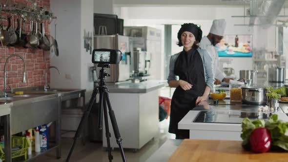 Female Cook Recording Cooking Show Program on Camera