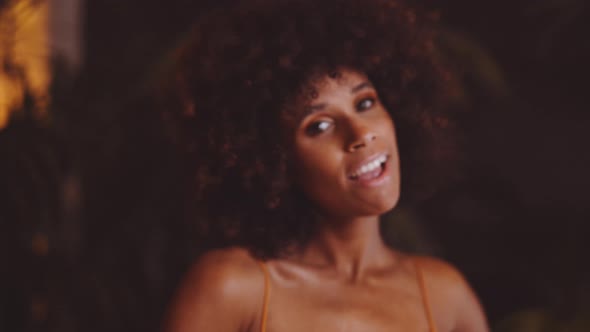 Beautiful Woman With Afro Dancing And Smiling To Camera