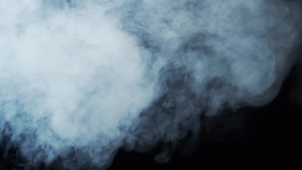 Smoke texture over blank black background. Mystical steam at night.