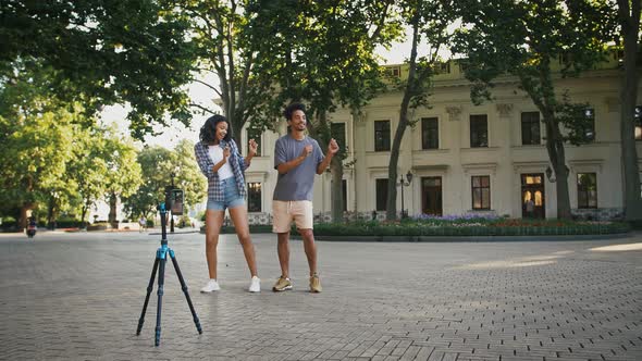 African American Couple Making Videos for Social Network