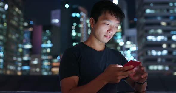 Man use of mobile phone at night