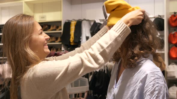 Two Best Friends Fool Around in a Clothing Store