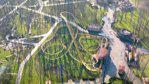 Roller Coaster in the Amusement Park in the Spring  Aerial View