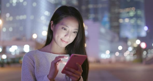 Young Woman Use of Mobile Phone at Night