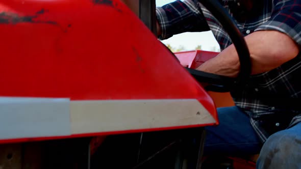 Portrait of man sitting in tractor