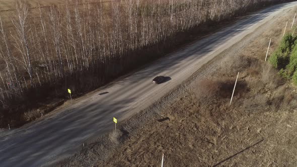 Aerial view of cars are driving along the spring road 13