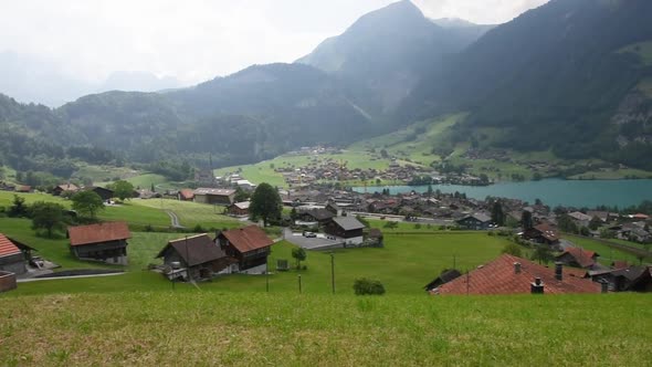 Stunning Turquoise Lake Lungerersee with Clear Water Landscape View of the Roofs of Traditional