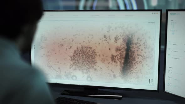 Scientist Using Modern Medical Software User Interface For Blood Molecules Study alt