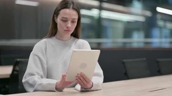 Woman using Tablet at Work