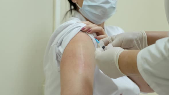 Pandemic Doctor Injects Vaccine Medication