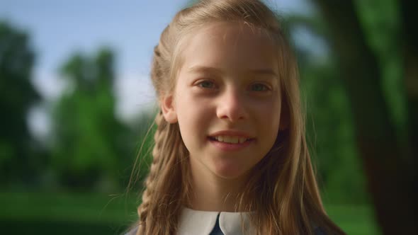 Blonde Girl Posing Alone with Pigtail Closeup