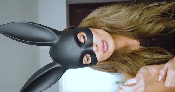Seductive Woman in Rabbit Mask Closeup  She Paint Lips and Flirting
