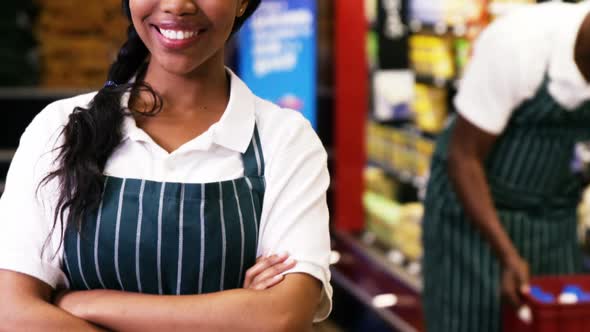 Portrait of female staff standing with arms crossed