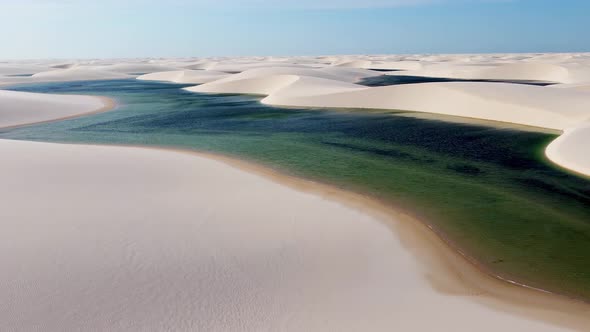 Sand dunes mountains and rain water lagoons at northeast brazilian paradise.