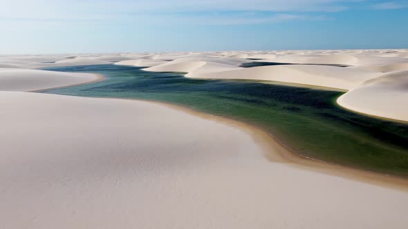 Paradisiac waves scenery of rainwater lakes and sand dunes at Brazil.