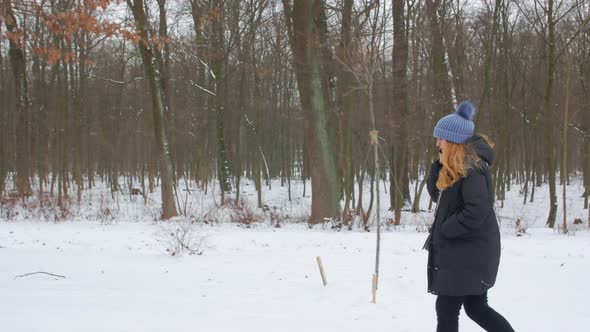 Woman Talking On The Phone And Walks