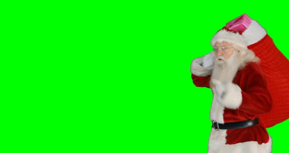 Santa claus carrying gifts in sack 4k