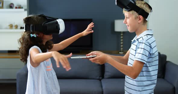 Kids using virtual reality headset in living room