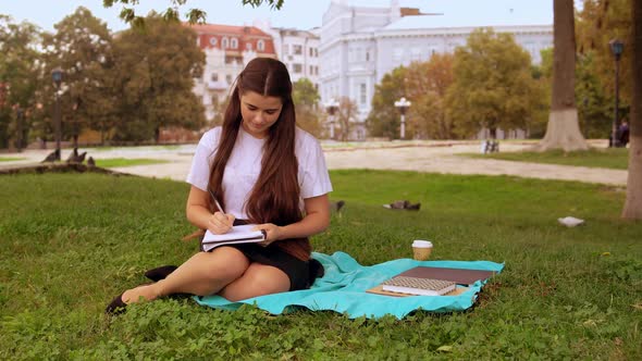 Girl Doing Homework Outdoors