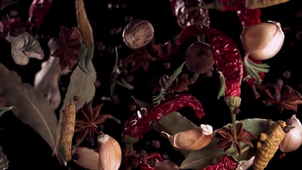 Super Slow Motion Shot of Flying Mix Spices in Black Background