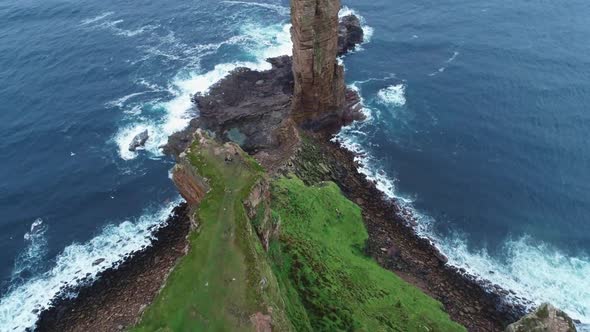 Slow motion, reveal shot of the Old Man oh Hoy, a 449ft high sea stack on Hoy, Orkney, Scotland.