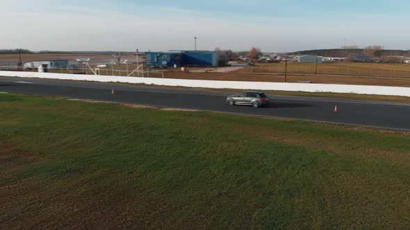 Four Cars Compete on the Race Track