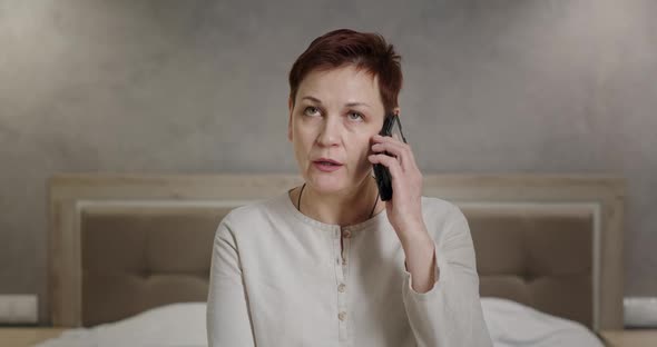 Serious Annoyed Woman Talking on the Phone Angrily Answers Rolling Her Eyes Unpleasant Phone