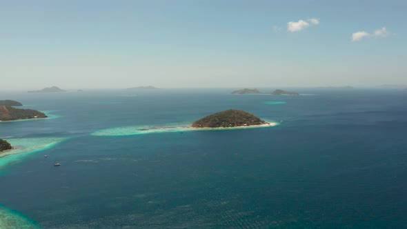 Small Torpic Island with a White Sandy Beach, Top View
