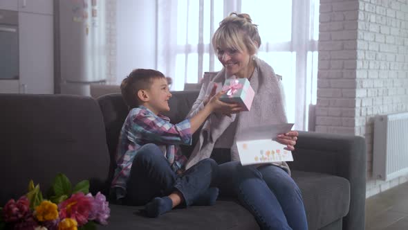 Son Presenting To Mom Greeting Card and Gift Box