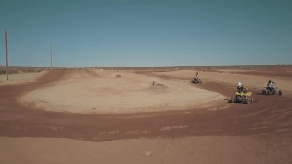 ATV riders turning a corner while racing, SLOW MOTION