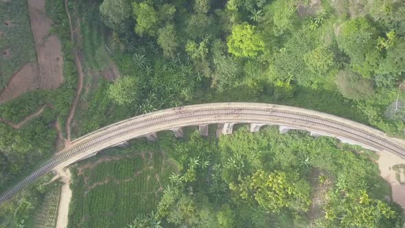 Ancient Demodara Train Bridge with People Near in Jungle