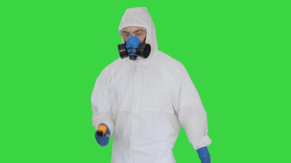Doctor in Protective Suit Checking Your Temperature on a Green Screen, Chroma Key