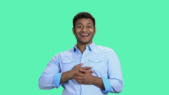 Handsome Indian Man Is Laughing on Color Background