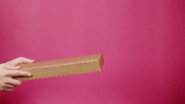 Square Cardboard Box on Pink Background