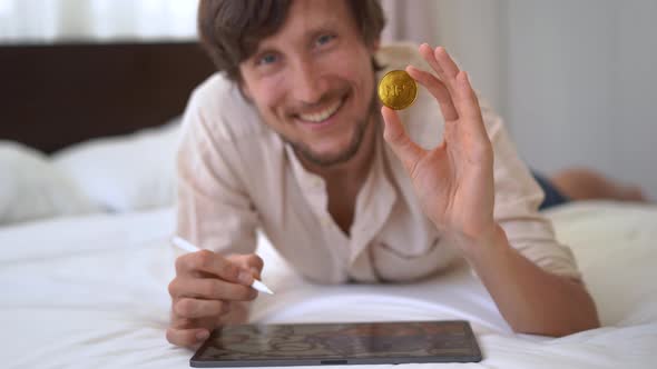 A Man Digital Artist Contemporary Painter Hold an NFT Coin in His Hand