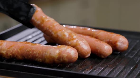 Meat Sausages Are Fried On Grill