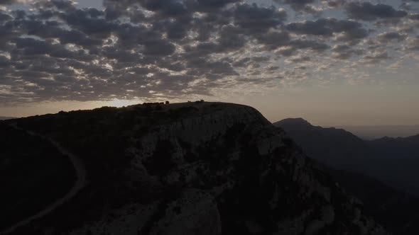 Sunset sky over mountain ridge in highland