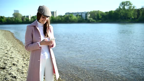 Beautiful young woman with smartphone