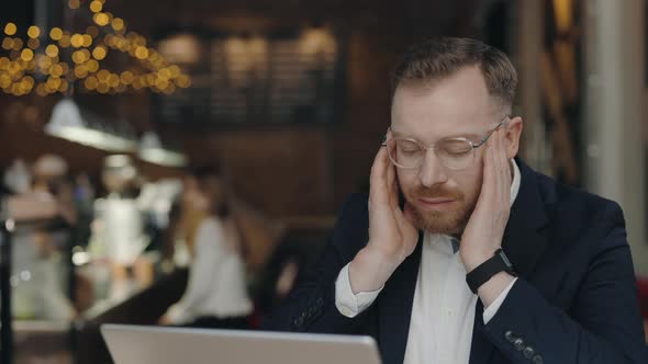 Business Manager Massaging Forehead While Suffering of Stress and Bad Headache