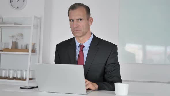 No Middle Aged Businessman Disliking Offer By Shaking Head