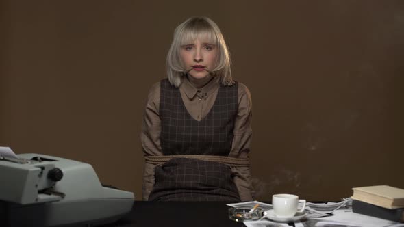 Portrait of Frightened Woman Being Kidnapped in Workplace and Suffering with Tied Hands and Mouth