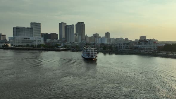 Aerial view of New Orleans and paddlewheel boat cruising