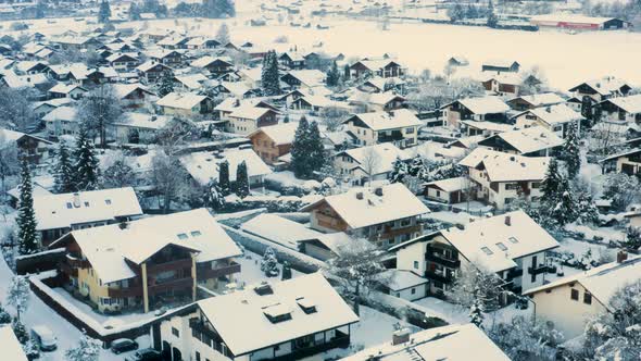 Snowy houses in german town of Garmisch-Partenkirchen, drone shot.