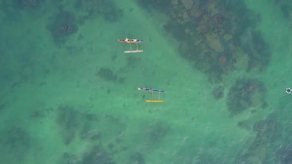 Little Boats Sail on Clear Azure Ocean Upper View