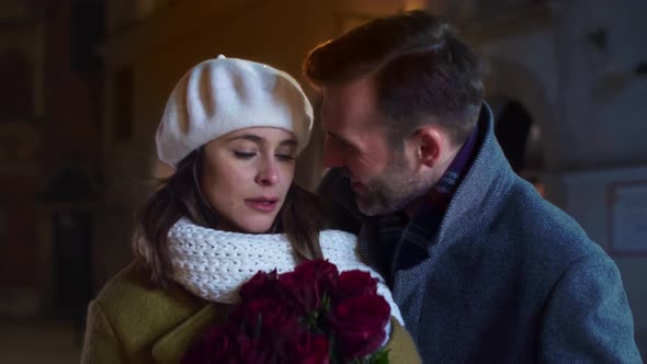 Mature man giving a bunch of roses