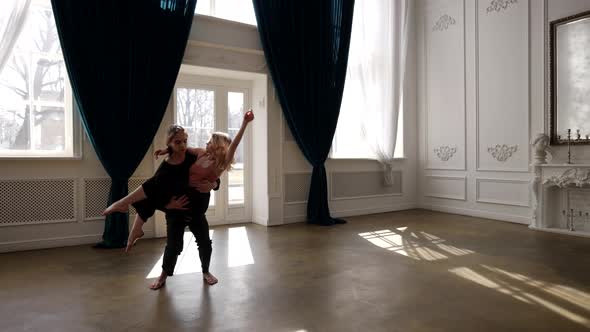 Emotional Dance of Young Loving Couple in Rehearsal Room Repetition of Contemporary Dance